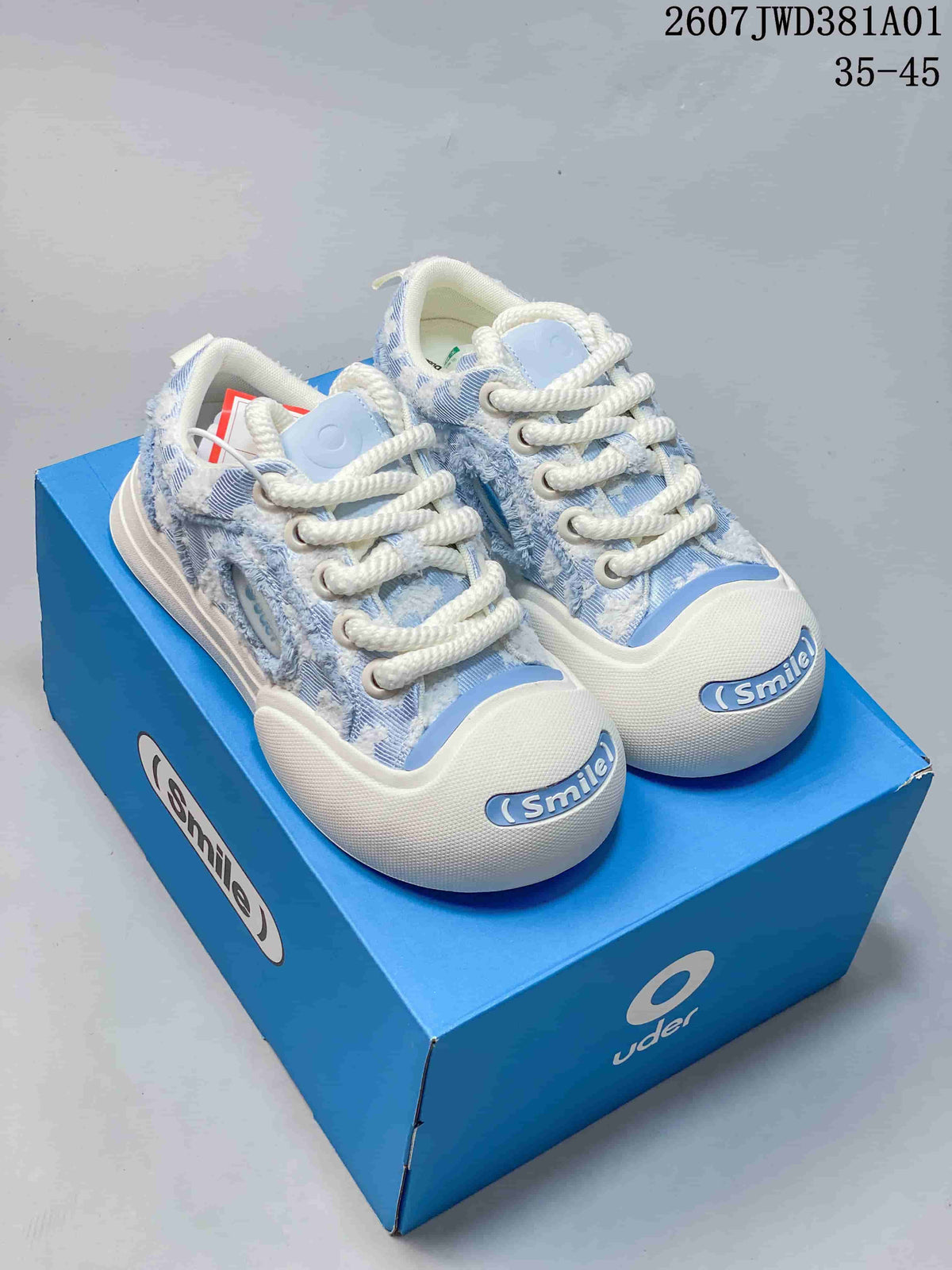 Blue-and-white denim-style Ouder chunky sneakers with rope laces and Smile toe detail.