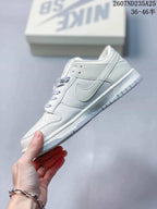 Side profile of the white low-top sneaker showing the layered panels, Swoosh detail and textured outsole.