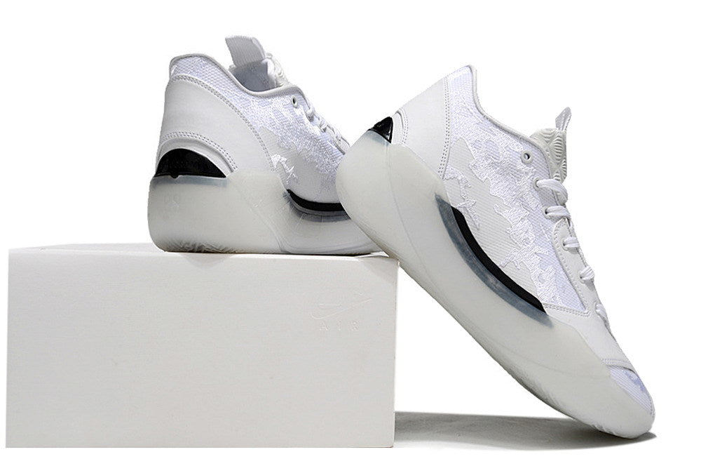 White Jordan sneakers shown from the rear and side on a box.