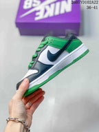 Side view showing the dark Swoosh, white side panel, green collar and green outsole.