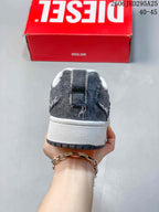 Rear view showing the charcoal heel panels and white midsole