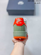Rear view showing the green heel, orange heel tab, and visible Air branding.