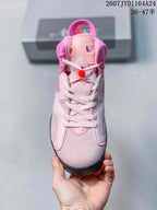 Front view of the pink high-top sneaker showing the tongue, white laces, padded collar and layered toe box.