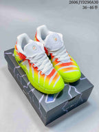 Pair of Nike Ja 3 basketball shoes in neon yellow, orange, and white, shown from the front on a shoebox.