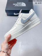 Side view showing the gray Swoosh and off-white low-top design