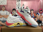 Angled side view of white Mizuno Wave Momentum 3 shoes with purple laces and coral and yellow accents.