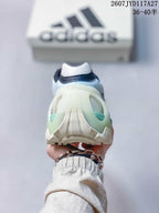 Rear view highlighting the sculpted cream heel structure, pale blue upper and mint-green heel accents.