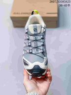 Front view showing the mesh toe box, quick-lace style cord system, padded tongue, and contrasting toe bumper.