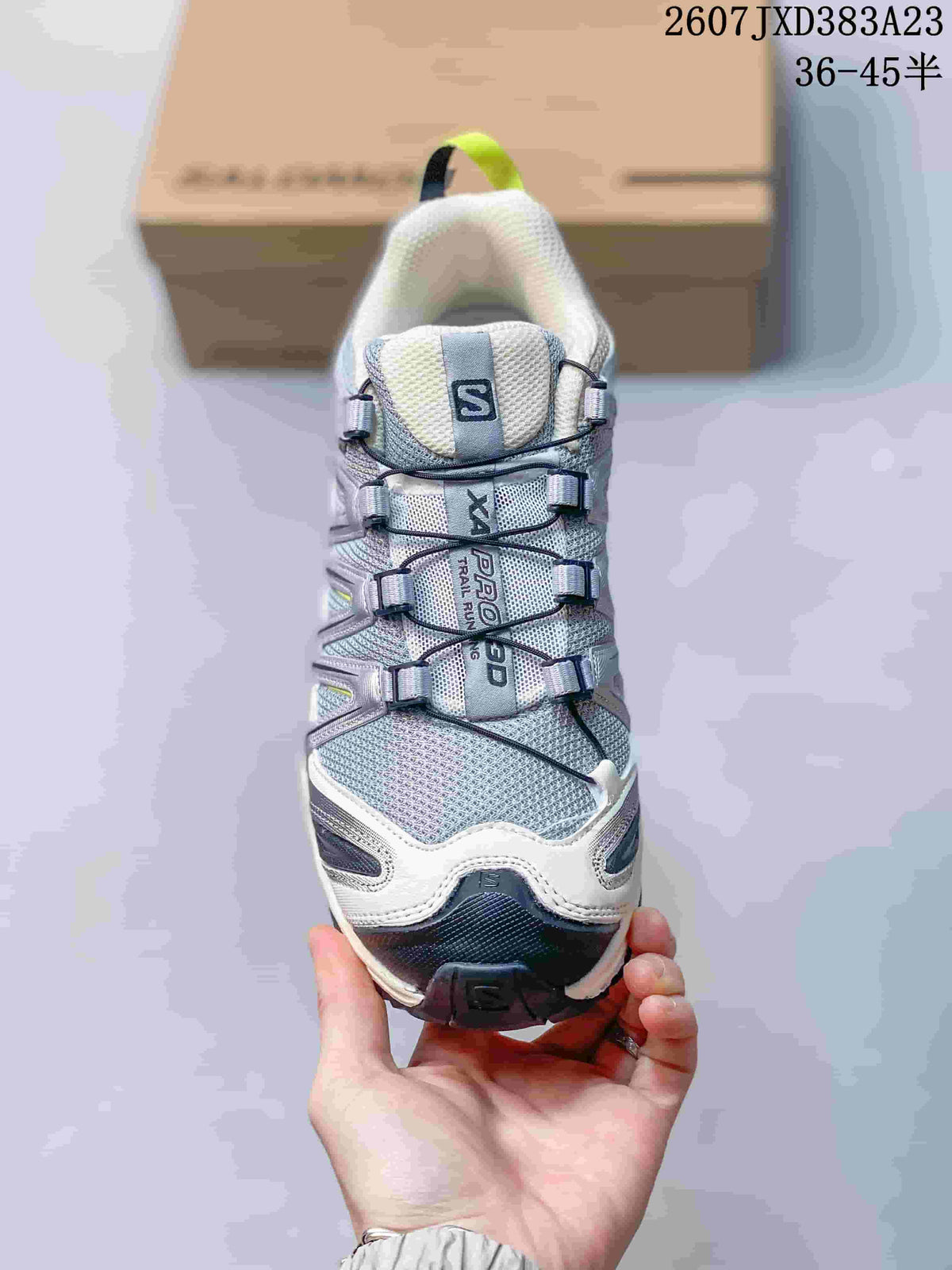 Front view showing the mesh toe box, quick-lace style cord system, padded tongue, and contrasting toe bumper.