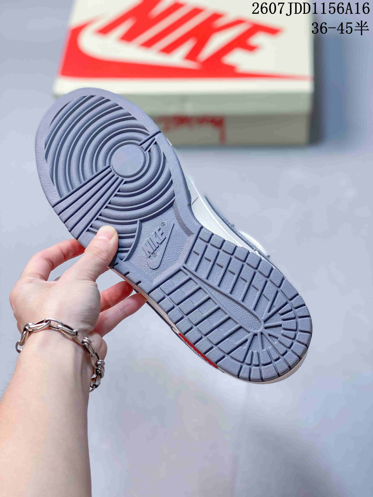 Close-up of the gray textured rubber outsole on a Nike SB Dunk Low sneaker; image text shows style code 2607JDD1156A16 and size range 36–45.5.