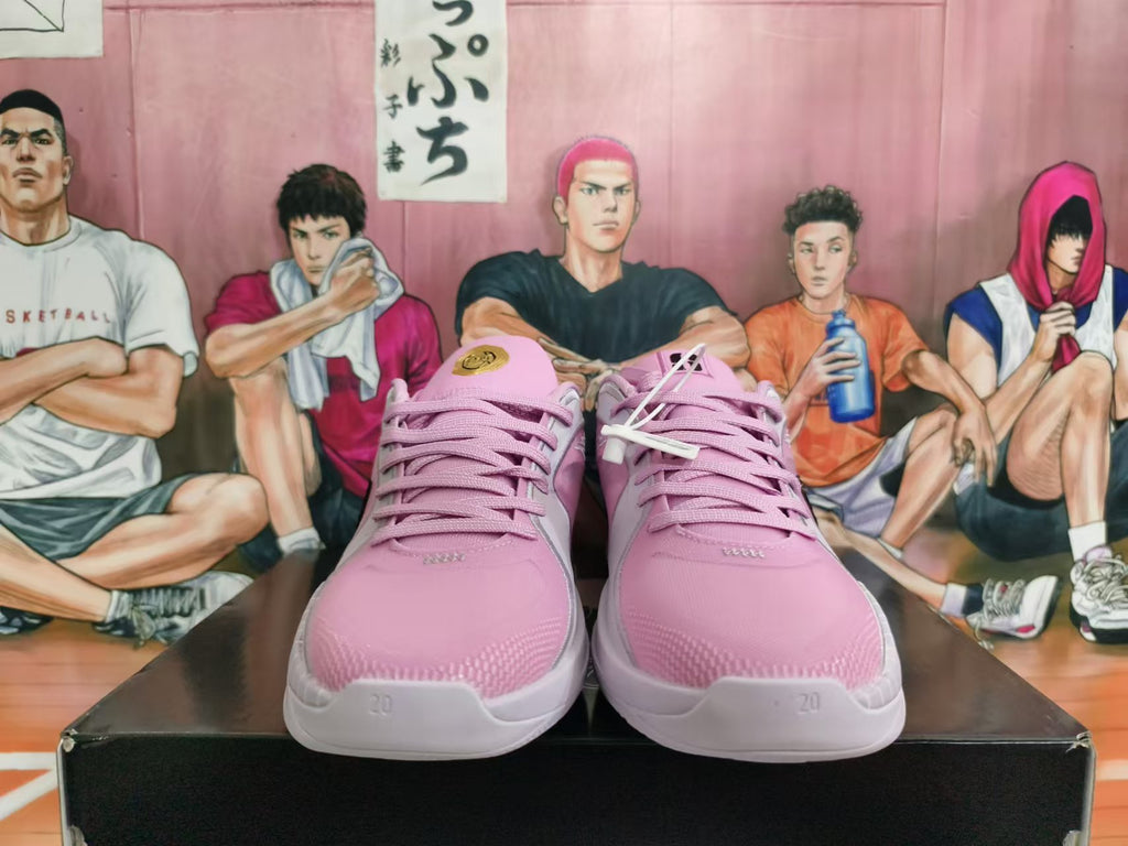 Front view of pink basketball shoes with matching laces