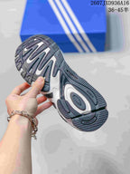 Bottom view showing the segmented black, grey and white rubber outsole.