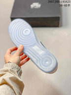 Underside view showing the translucent blue outsole with concentric traction patterns.