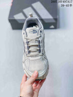 Top view of the sneaker showing the perforated mesh toe box, tongue branding, and lace-up closure.