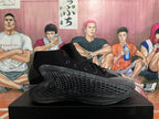 Side profile showing the textured dark gray panels and sculpted outsole.