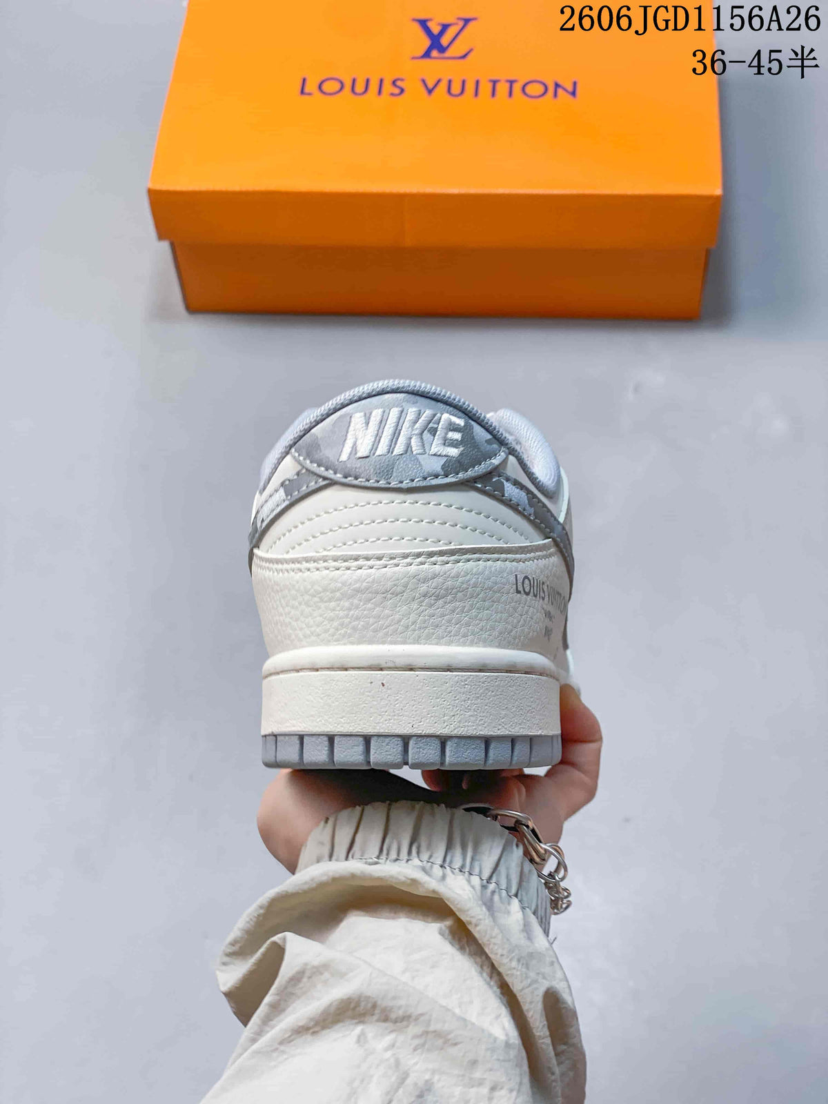 Rear view of a white and grey low-top sneaker