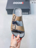 Top view of the sandal showing the open toe, two buckle straps, branded footbed, and contrasting colors.
