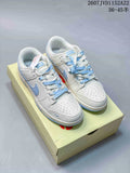 Pair of white and light blue Nike low-top sneakers displayed on a shoebox.