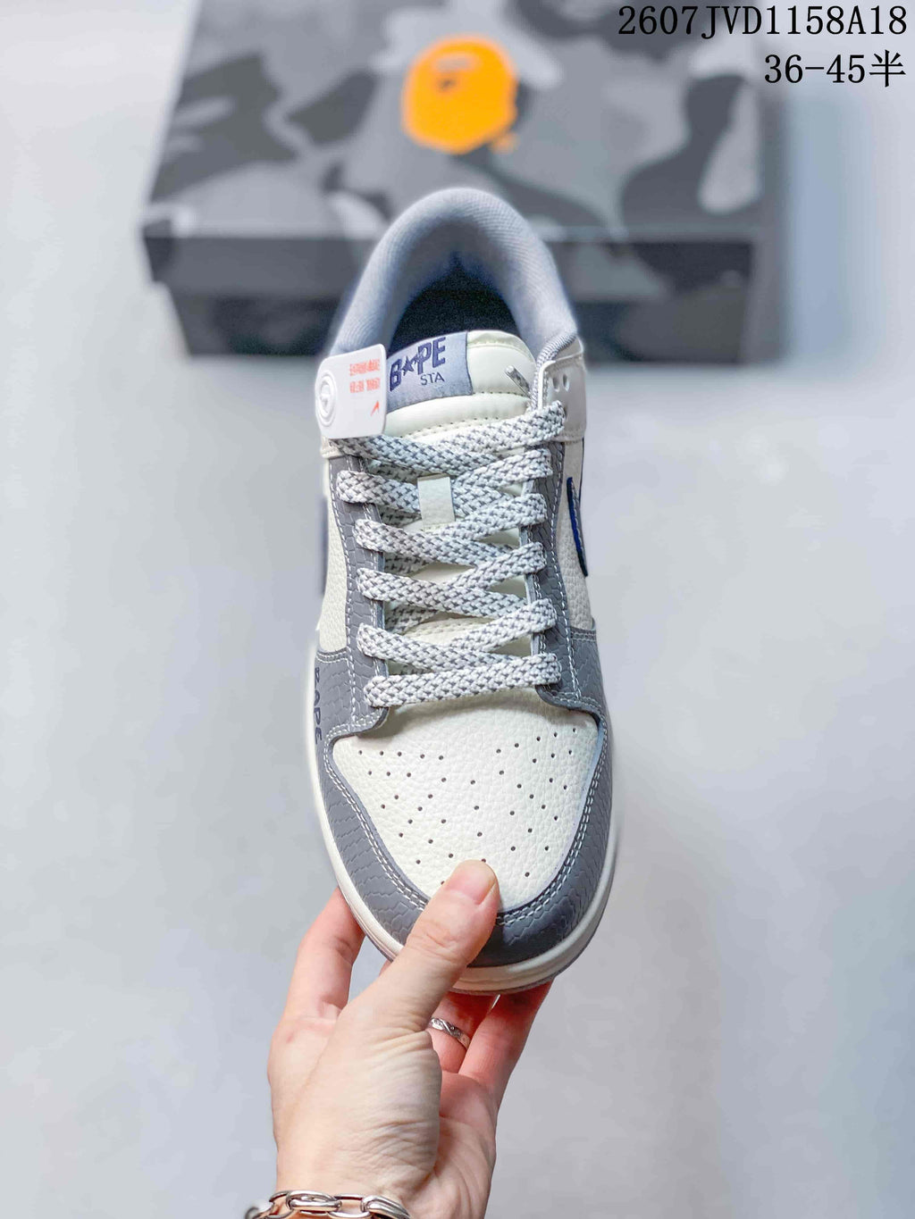Top view showing the perforated cream toe box, gray overlays, and patterned laces.
