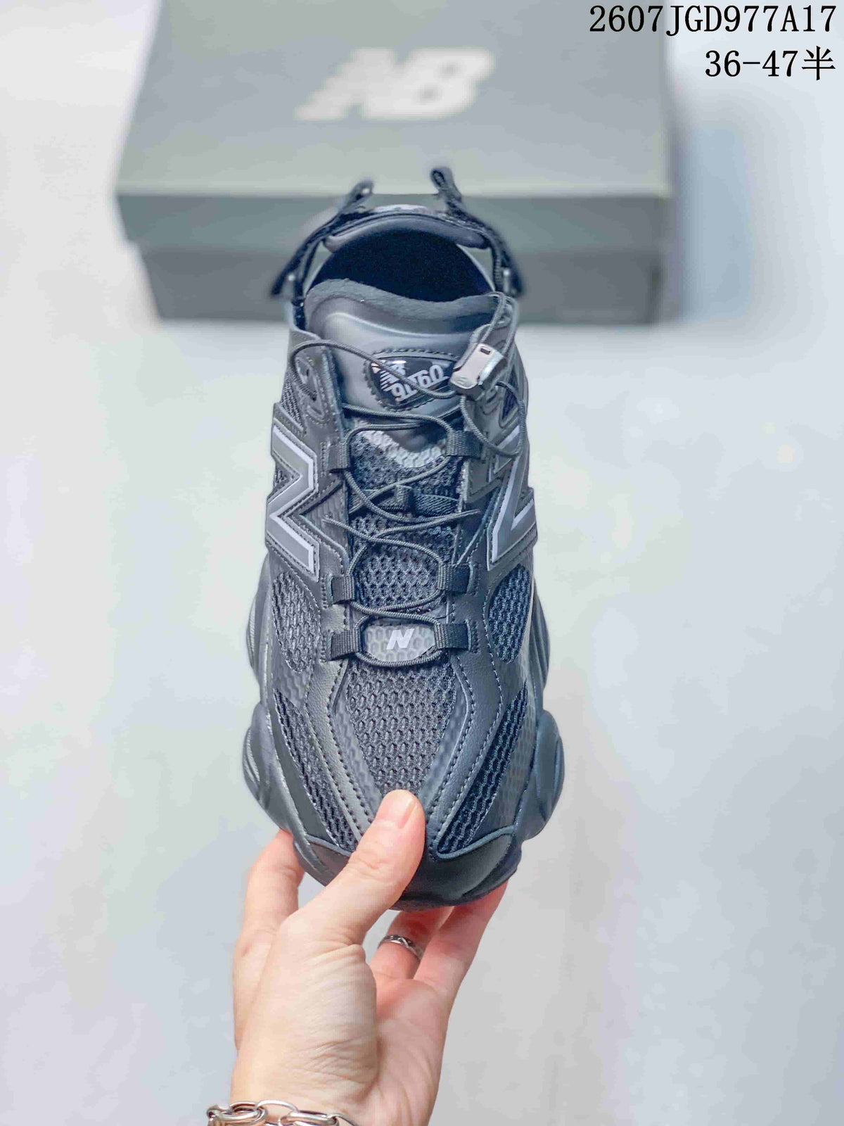 Top view of the New Balance 9060 sneaker showing the lace-up closure, mesh tongue, tongue branding, and contrasting overlays.