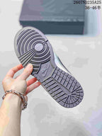 Close-up of the sneaker outsole showing a circular forefoot tread and segmented rubber pattern.