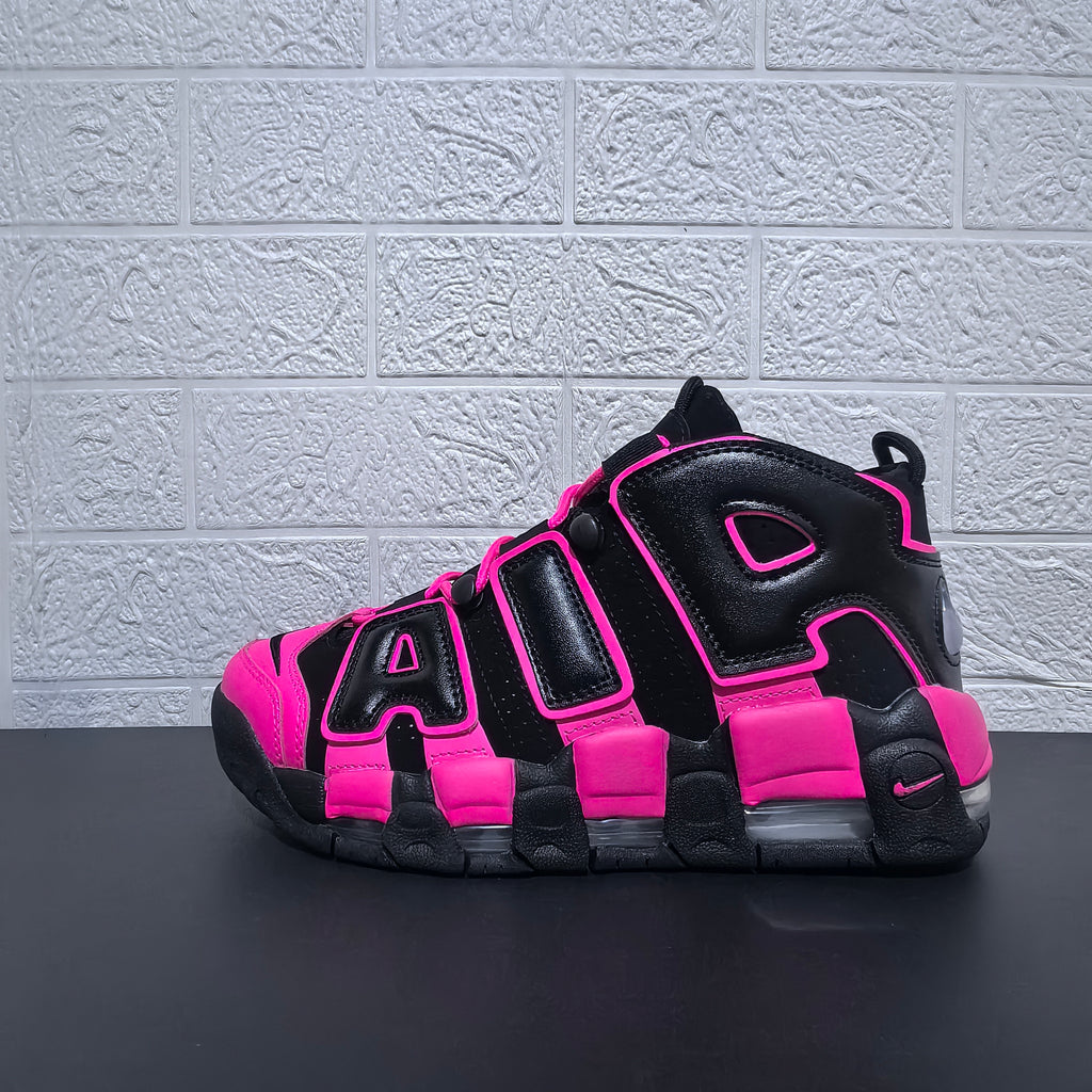 Side profile of a black and pink Nike Air More Uptempo sneaker
