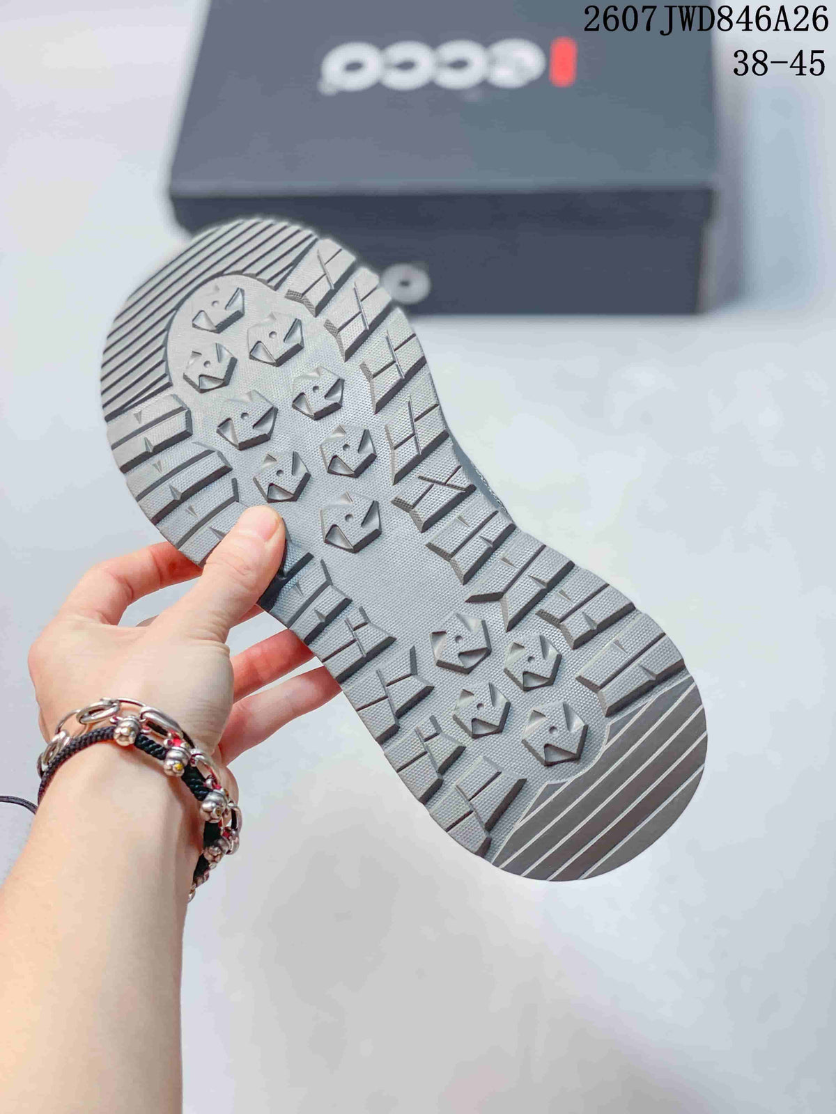 Close-up of the grey sneaker outsole showing its raised geometric tread pattern.