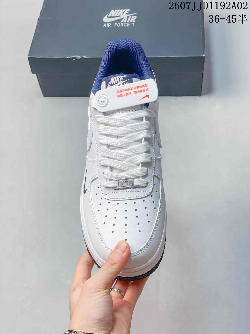 Front view showing the perforated toe box, laces, and navy collar