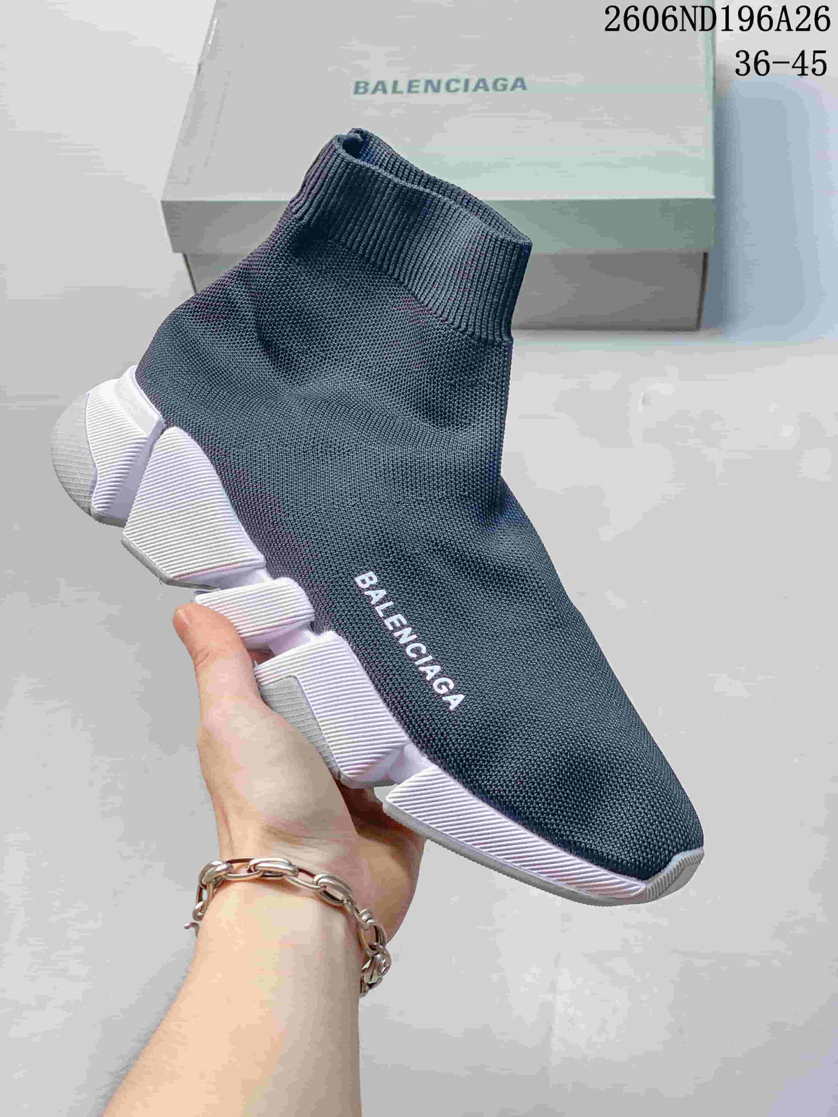 Dark knit sock-style sneaker with a segmented white sole.