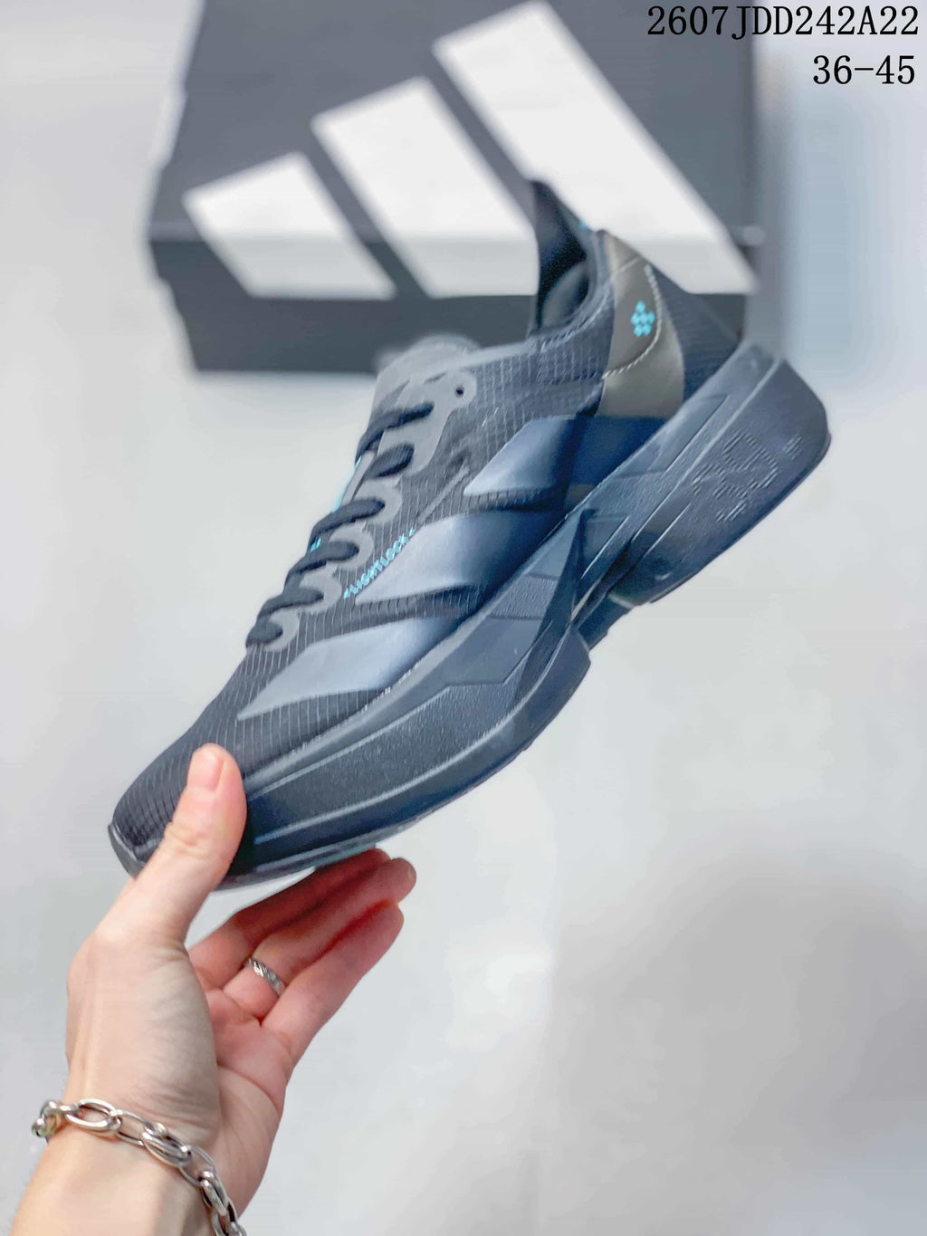 Side profile showing the layered upper panels, lace-up front, and sculpted black sole.