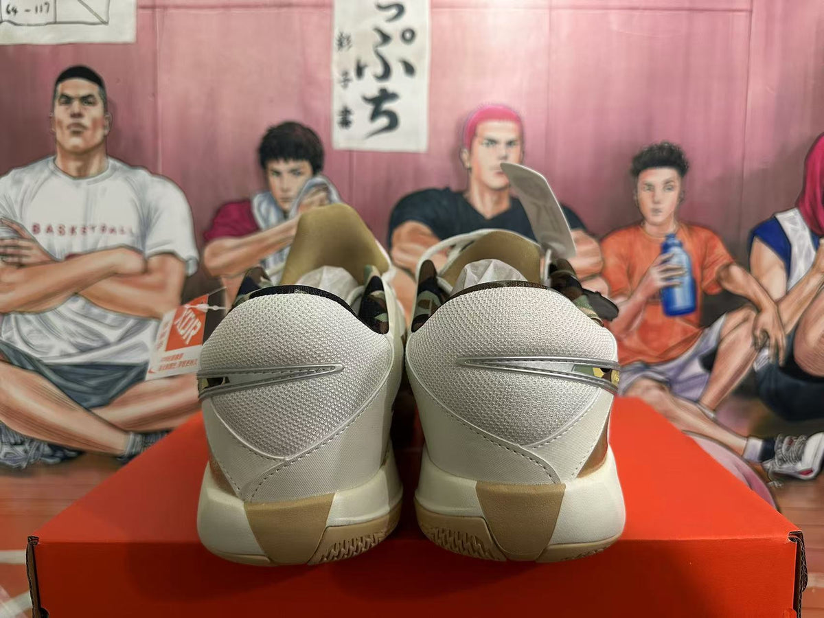 Rear view of white and yellow Nike basketball shoes with sculpted heel panels