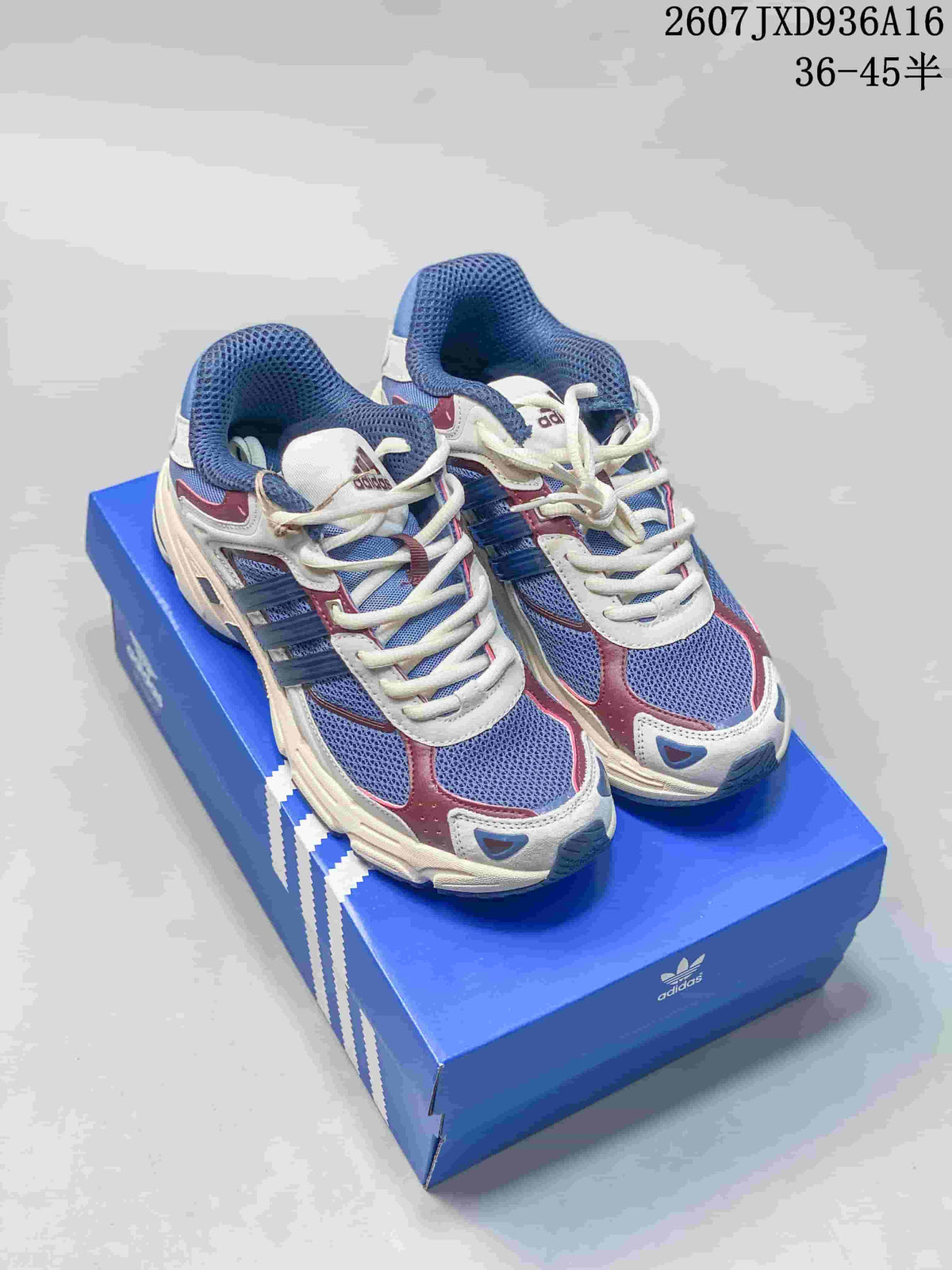 Pair of blue, cream and burgundy adidas Response CL sneakers displayed on a blue adidas shoe box.