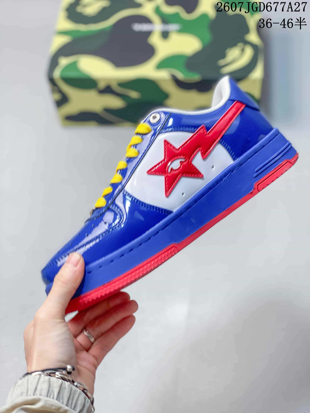 Side view of a blue and white low-top sneaker with a red star detail, yellow laces, and a red outsole.