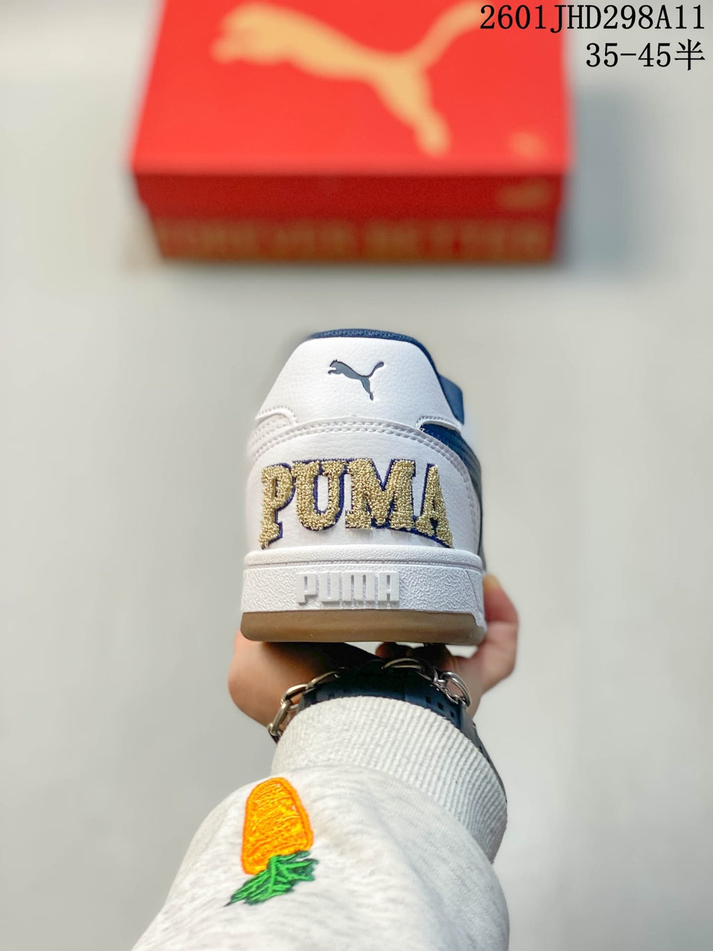 Rear view showing the embroidered Puma heel branding and gum-toned outsole.