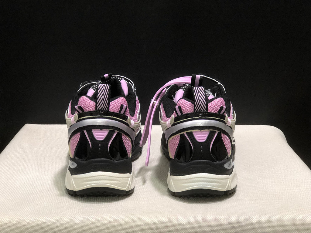 Rear view showing the heel pull tabs, black heel panels, and white midsoles.