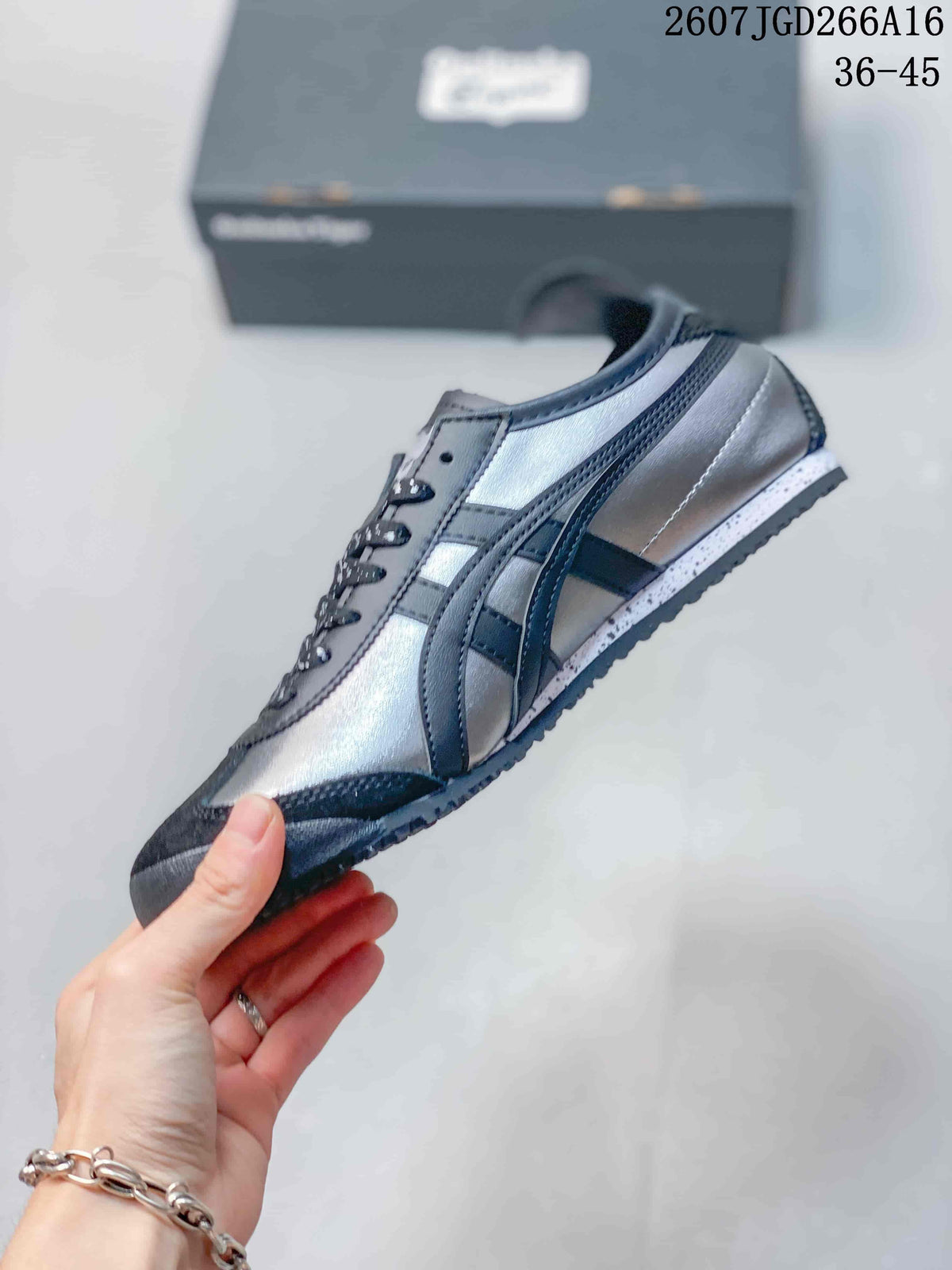 Side profile showing the black and silver upper, contrast stripes, and low-top shape.