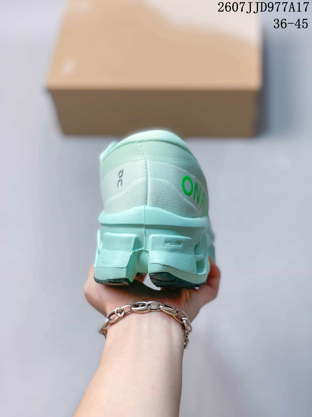 Rear view of the mint green sneaker showing padded collar construction, heel branding, and the segmented sole.