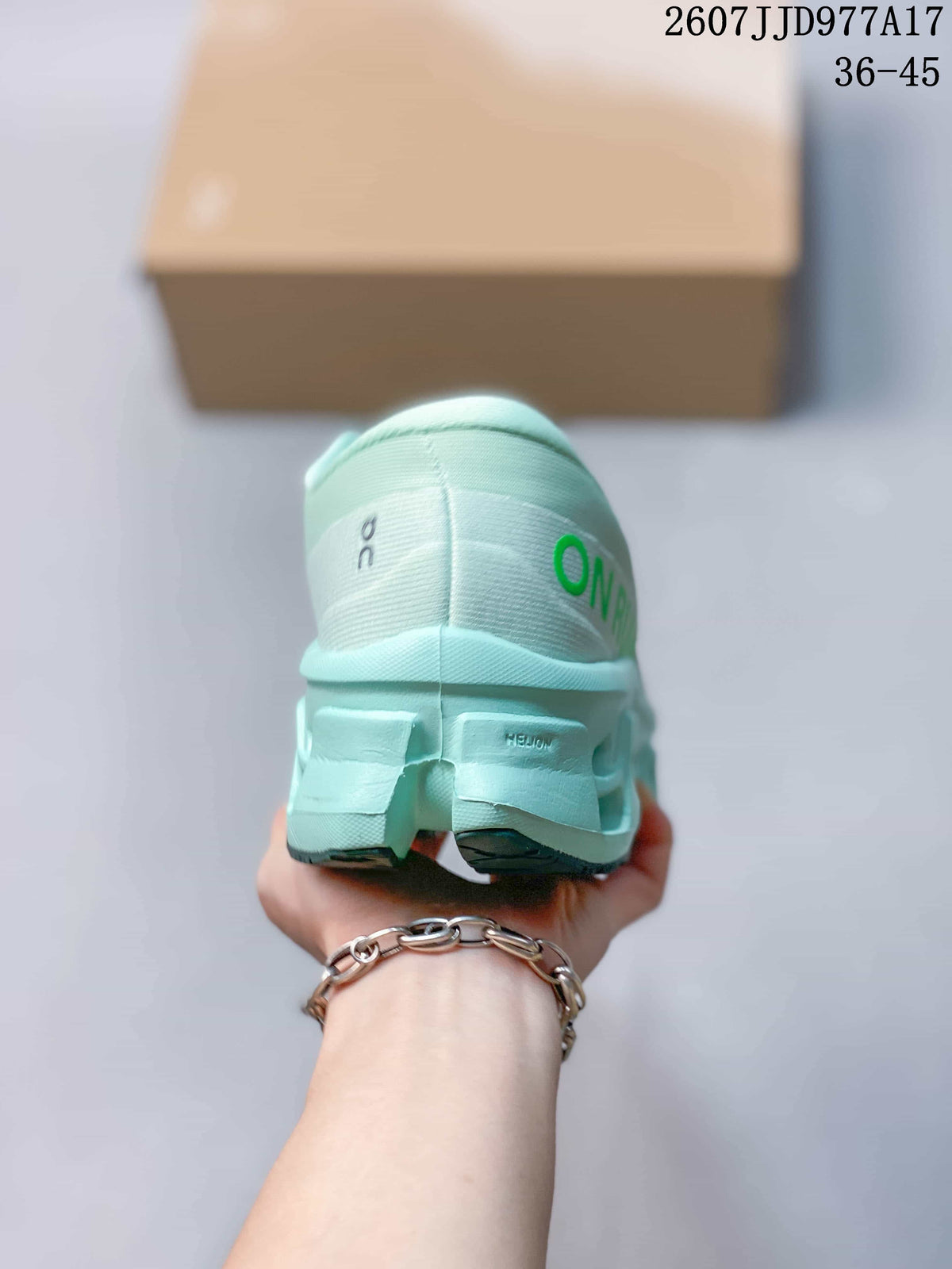 Rear view of the mint green sneaker showing padded collar construction, heel branding, and the segmented sole.