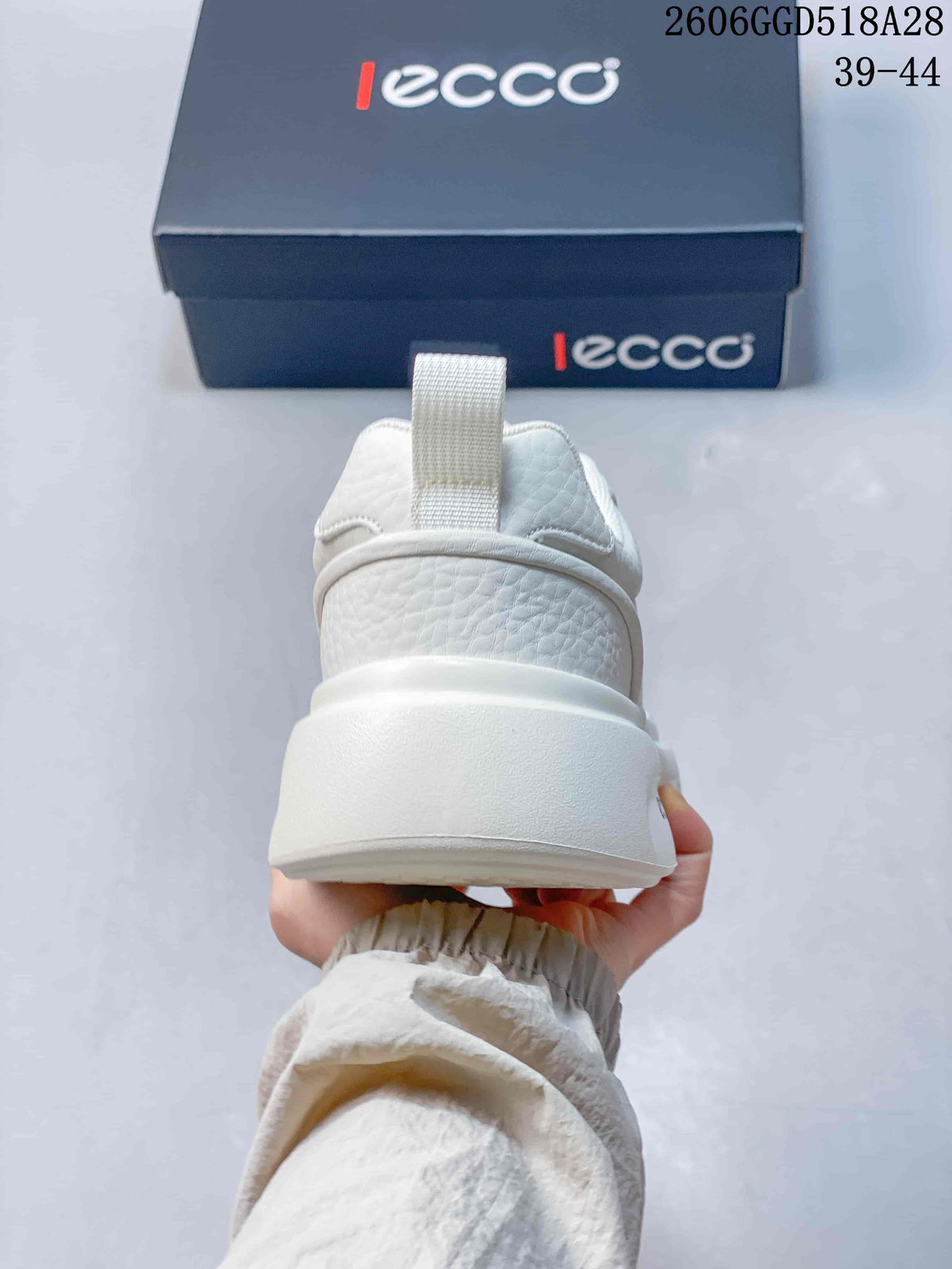 Rear view showing the white sneaker heel and thick sole