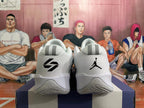 Heel view of white and grey basketball shoes with black logos