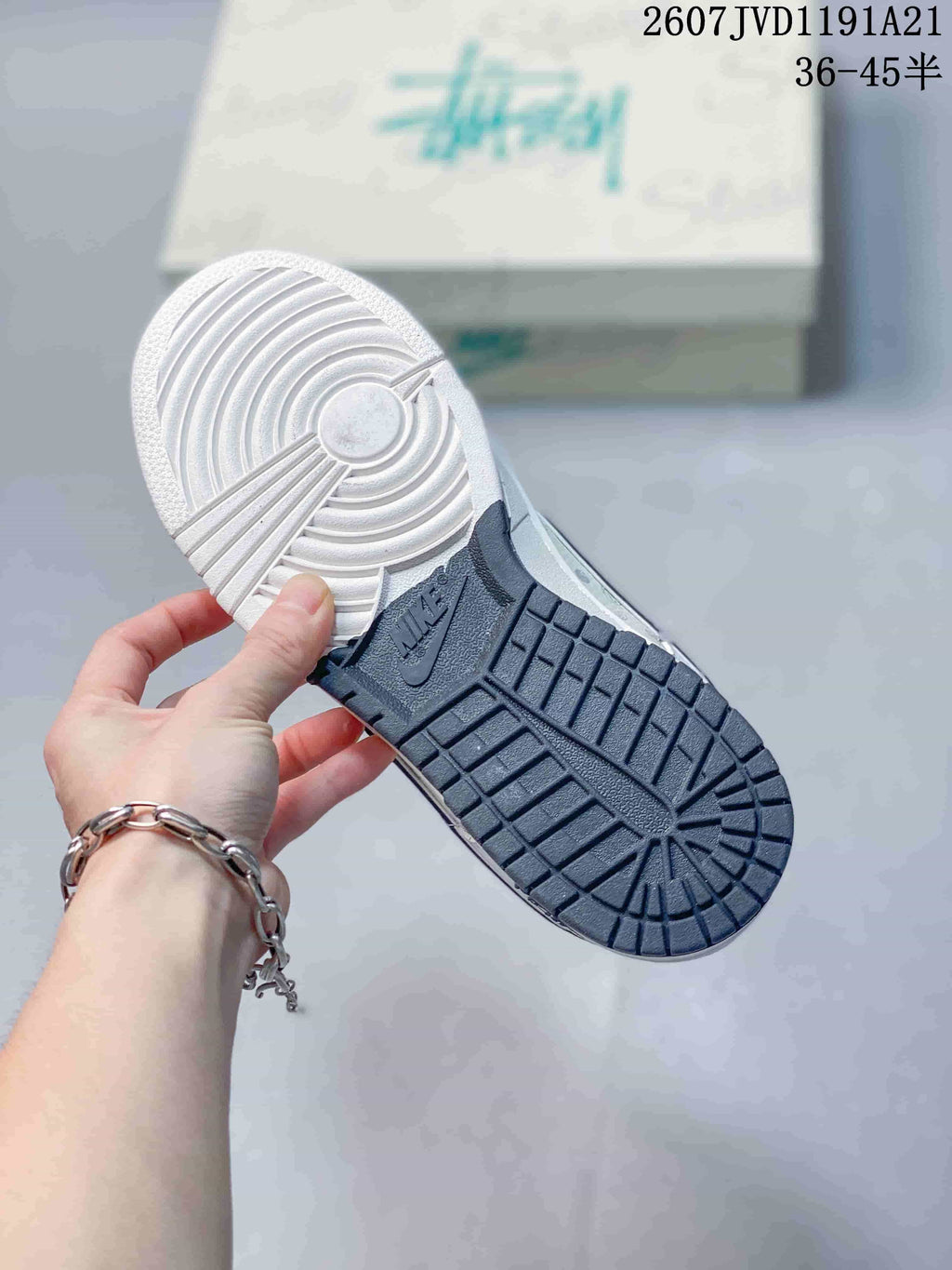 Bottom view showing the dark rubber traction outsole and white forefoot section.