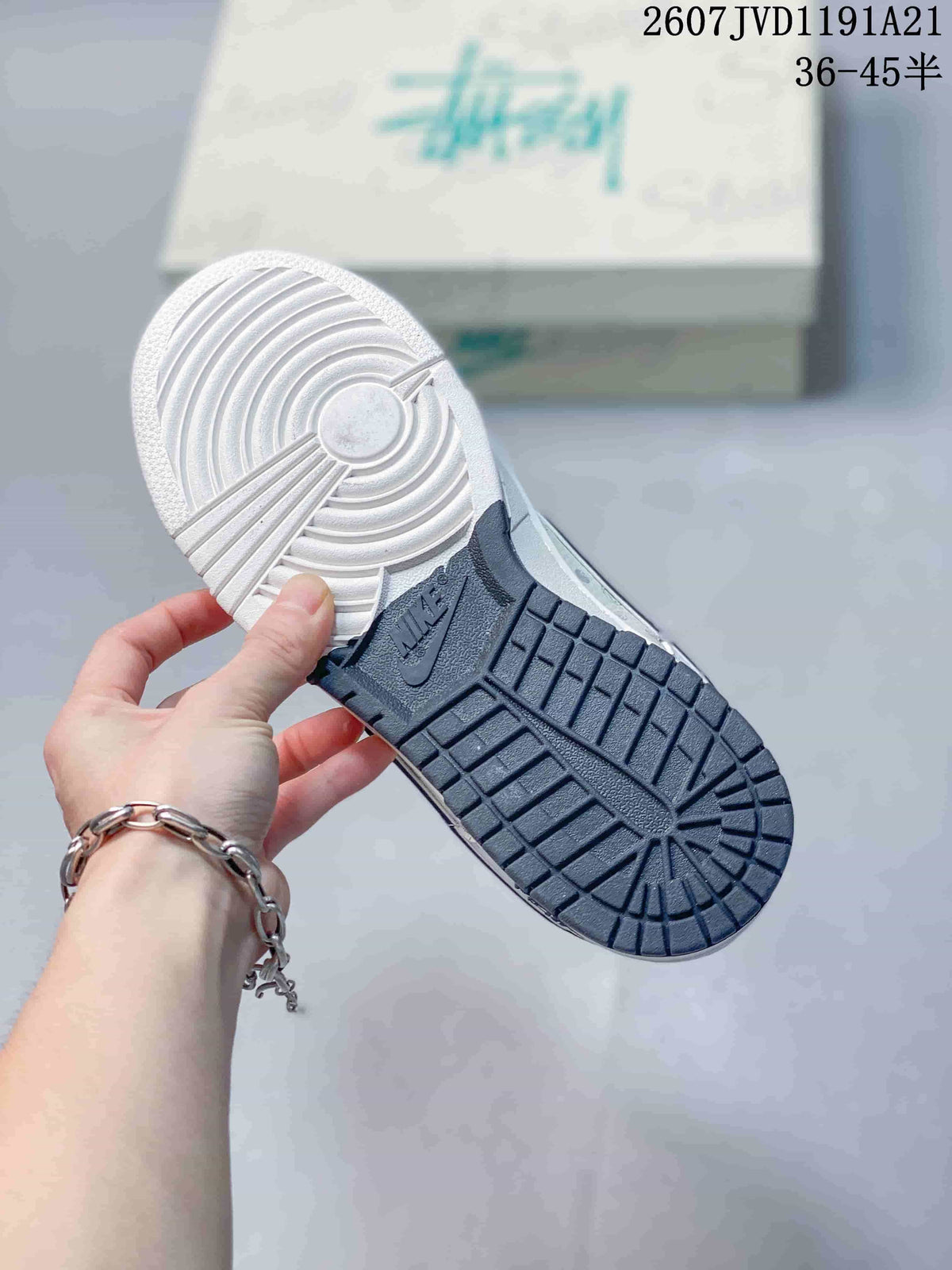 Bottom view showing the dark rubber traction outsole and white forefoot section.