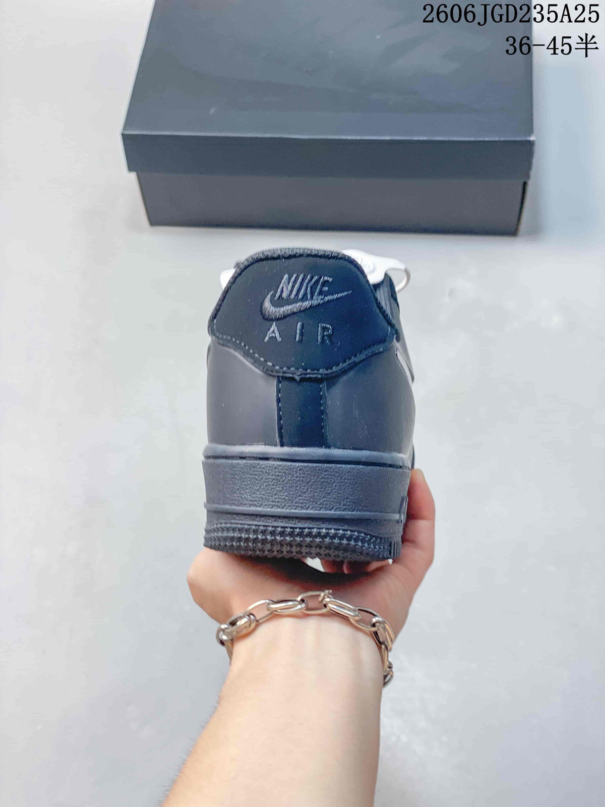 Rear view of the sneaker showing Nike Air branding, padded collar, heel panel, and layered outsole.