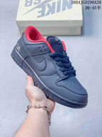 Charcoal Nike Dunk Low sneaker with navy laces and red collar lining; image overlay shows sizes 36–45.5.