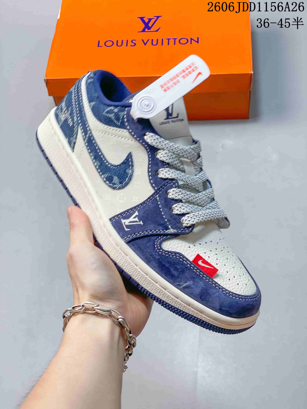 Side view of a white sneaker with blue overlays, a patterned panel and a contrasting sole.