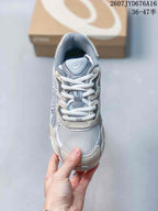 Top view of the sneaker showing the mesh toe box, padded tongue, and white laces.
