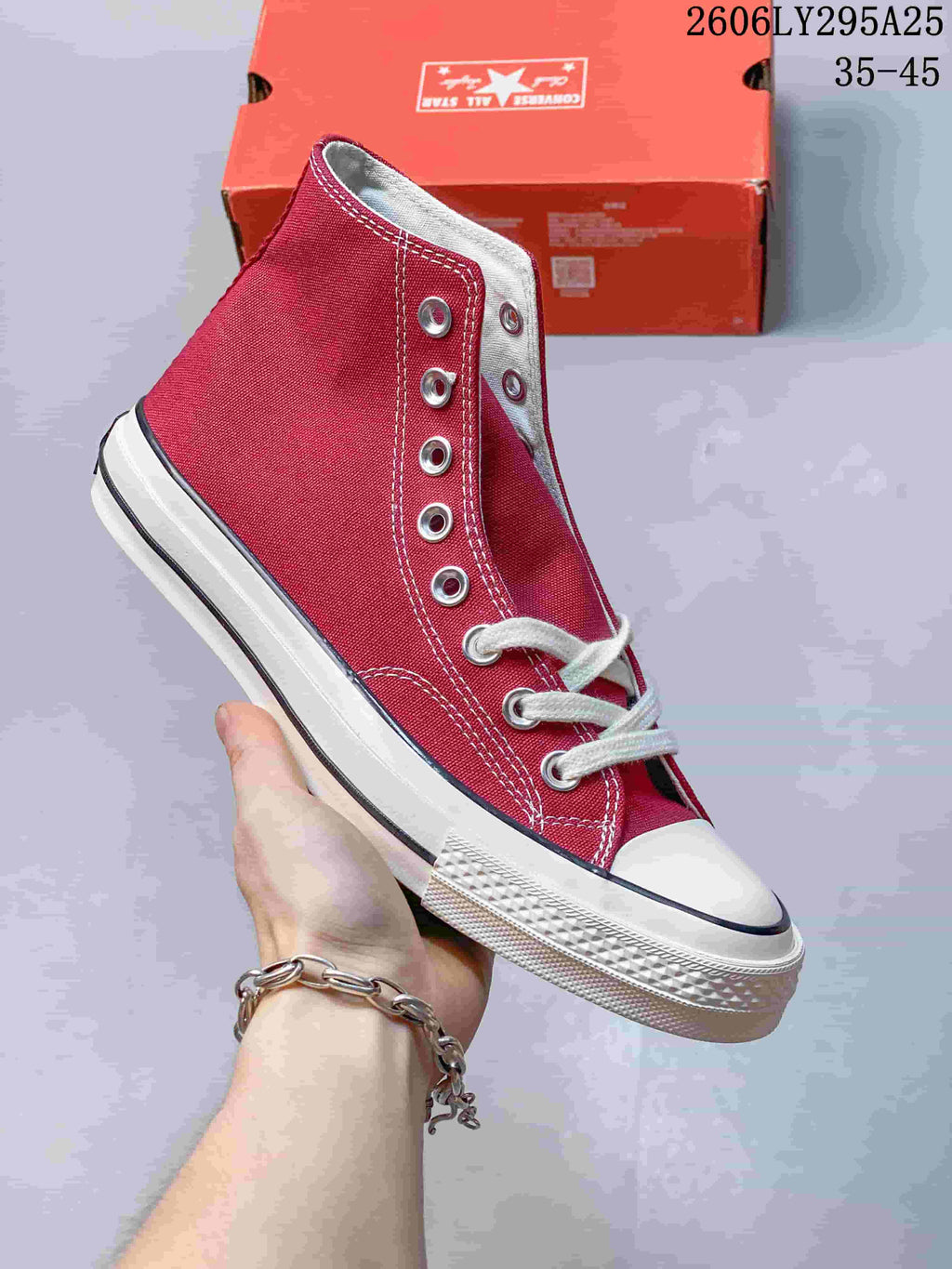 Burgundy high-top sneaker with white laces, metal eyelets, and a rubber toe cap; size range 35–45 is printed in the image.