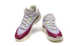 Front view of Nike KD basketball shoes with white laces and purple, pink, and lime details