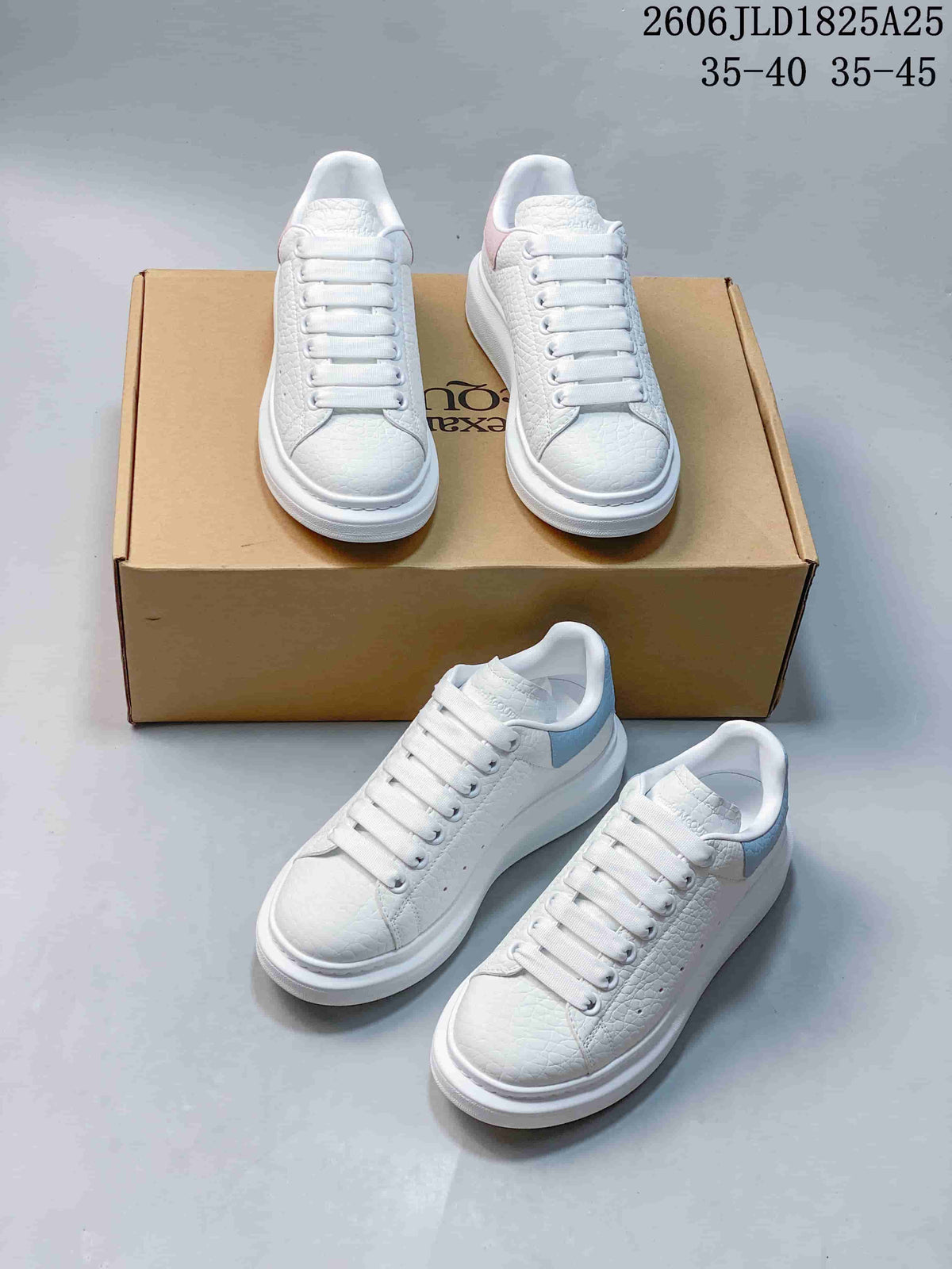 Multiple views of white textured platform sneakers with pastel pink and pale blue heel panels.