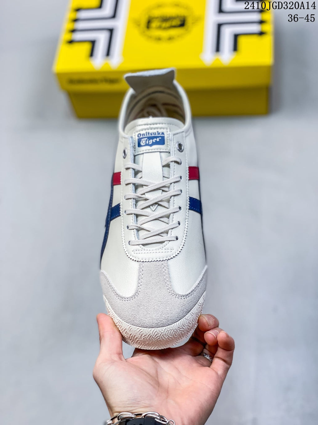 Front view showing the white laces, branded tongue label, textured toe overlay, and blue and red side stripes.